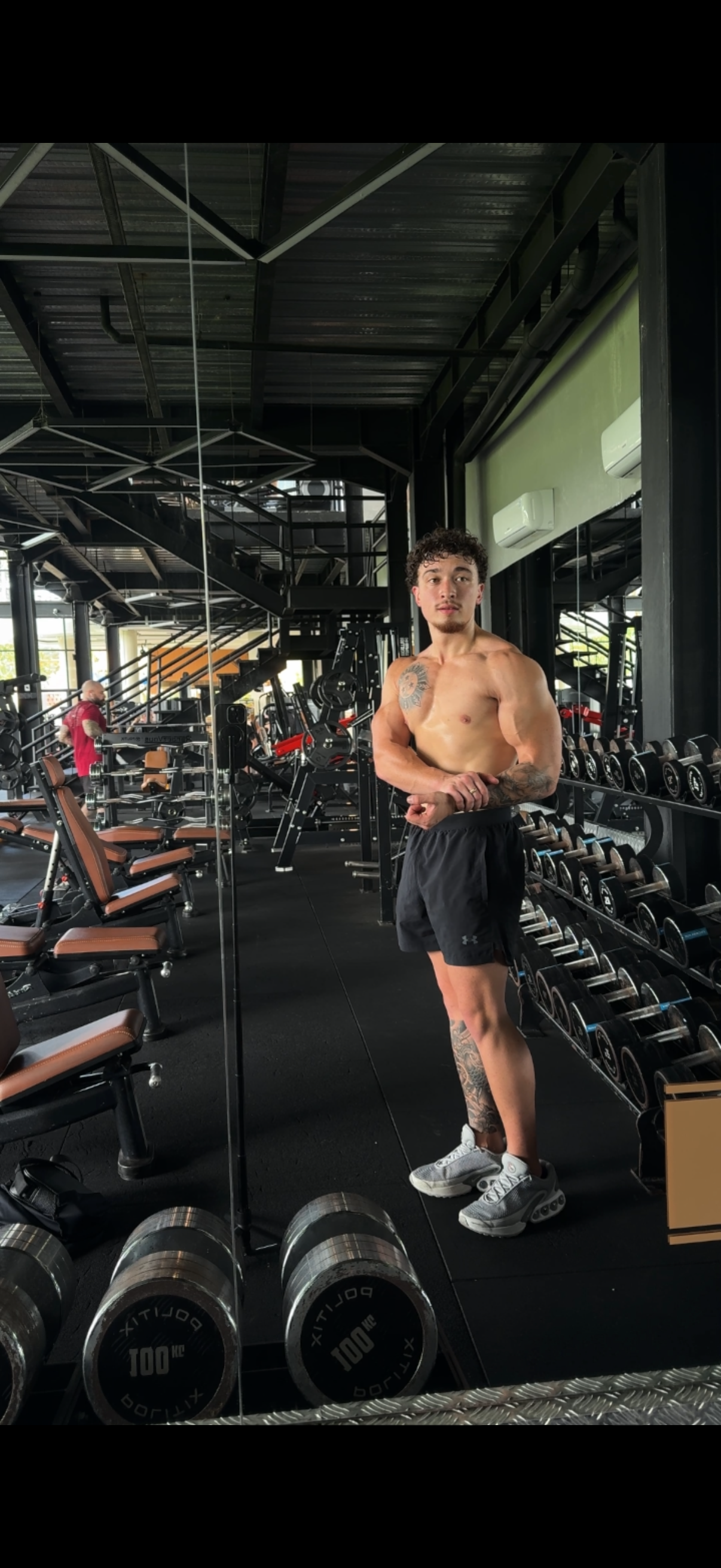 Ethen, personal trainer at EKM Wellness, with a client in the gym